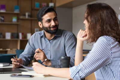 man and woman discussing work