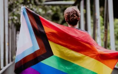 Person holding the LGBTQ flag