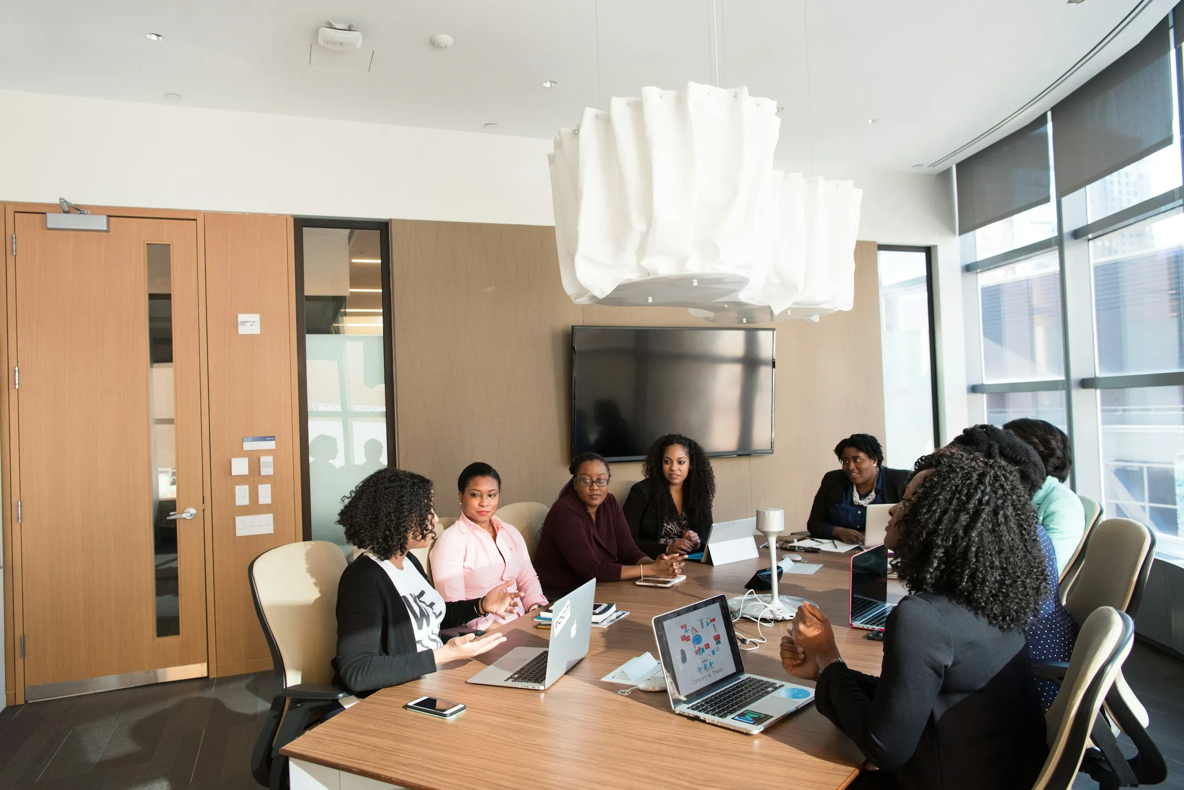 Black business women in a conference room